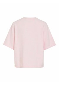 Roza kratka majica z okroglim izrezom in sproščenim krojem. Iz mehke tkanine, s preprostim dizajnom brez vidnih dodatkov.