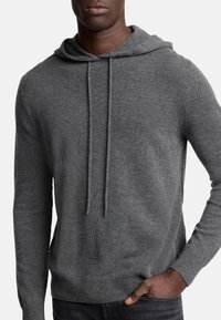 Grauer Kapuzenpullover aus weichem Stoff, mit Kordelzug, gerippten Bündchen und Saum, sowie einer schlichten, strukturierten Oberfläche.