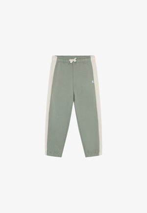 Pantalon de survêtement vert avec panneaux latéraux gris clair, taille élastique et poignets. Le tissu semble doux avec une texture lisse. Petit logo sur le devant.