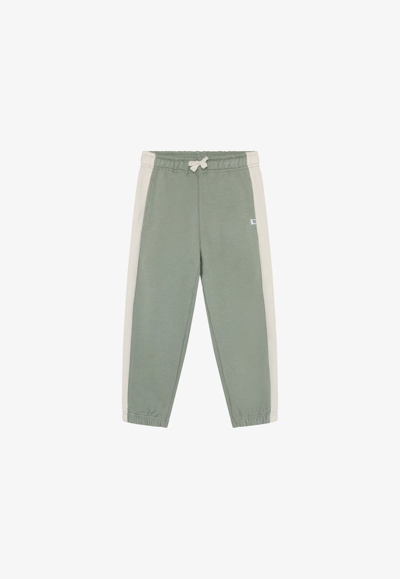 Pantalon de survêtement vert avec panneaux latéraux gris clair, taille élastique et poignets. Le tissu semble doux avec une texture lisse. Petit logo sur le devant.