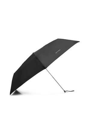 Black compact umbrella with slim silver handle and wrist strap, partially open, resting on side against white background.