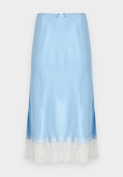 Φούστα από μεταξωτό ζιπ λοκ σε ανοιχτό γαλάζιο με λευκή δαντέλα με κυματιστό τελείωμα. Διαθέτει ελαστική μέση με σούρες και μικρό φιόγκο στο πάνω μέρος.