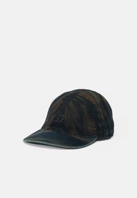 Cap made of textured, dark fabric with a tie-dye pattern in shades of green and brown. Features a curved brim and a black logo patch on the front.