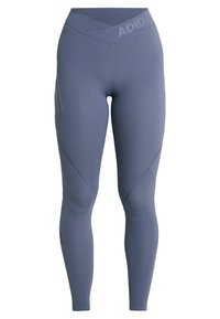 Niebieskie legginsy sportowe z teksturowanym, bezszwowym fasonem, wysokim stanem i charakterystycznymi trzema paseczkami po bokach.