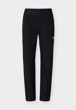 Pantalon d'extérieur noir avec une texture lisse et une ceinture élastique. Présente un logo sur la cuisse supérieure et une coupe étroite pour faciliter la mobilité.