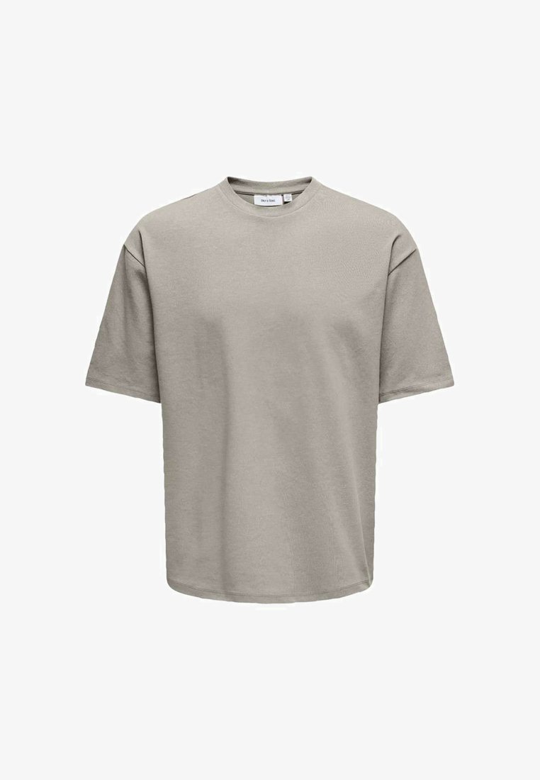T-shirt grigio in cotone con maniche corte, scollo rotondo e vestibilità morbida. Tessuto morbido e design minimalista senza motivi o dettagli.