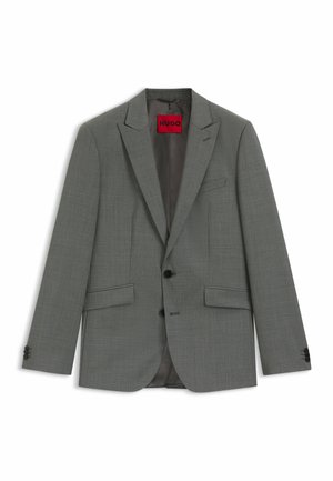 Grå blazer lavet af tekstureret stof. Har en notched revers, to forlommer, sorte knapper og et rødt inderlabel.