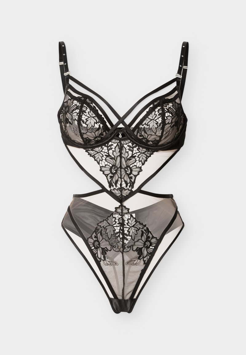 Μαύρο διαφανές κορμάκι δαντέλας με λουλουδάτα μοτίβα, ρυθμιζόμενους ιμάντες και λεπτομέρειες με κοψίματα σε ανοιχτό φόντο.