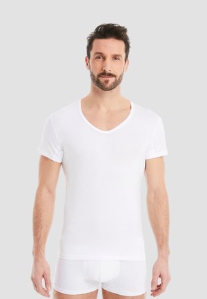 FINN Design SCHWEISS REDUZIERENDES FUNKTIONS - Undershirt - weiß