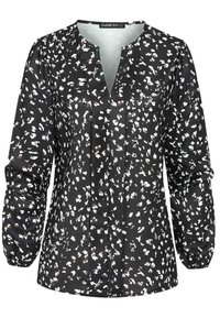 Svart bluse med hvitmønstrede blomster, V-hals, lange ballongsærmer og rynkede mansjetter. Laget av lett stoff med subtil glans.