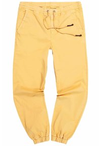 Gele joggingsbroek met een elastische tailleband, verstelbaar trekkoord en elastische boorden. Voorzien van zijzakken en een gladde, lichte stof.