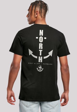 Black cotton t-shirt featuring large gray "NORTH" text, arrows, and a logo at the bottom, with a relaxed fit and short sleeves.
