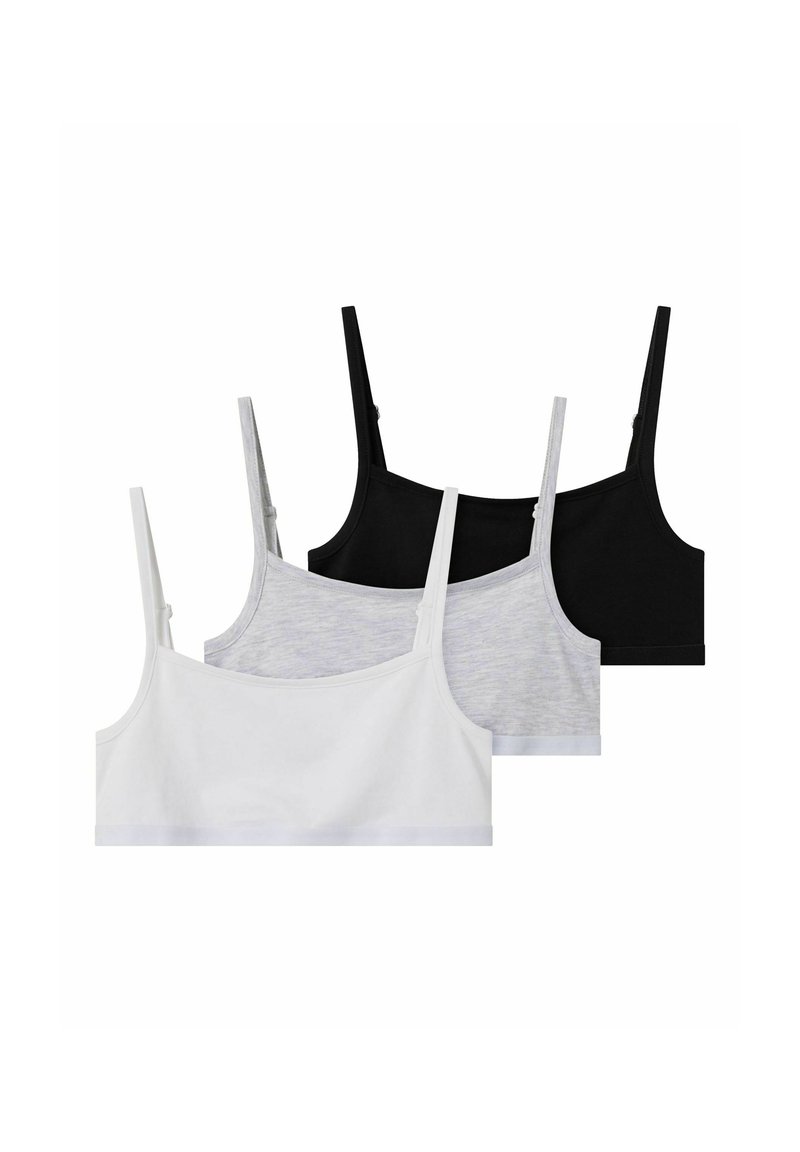 Trois soutiens-gorge sans couture en noir, gris et blanc. Fabriqués en tissu doux et extensible avec des bretelles réglables et un design basique confortable.