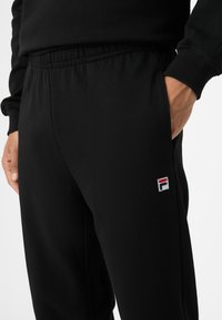 Fila BIELLA REGULAR - Verryttelyhousut - black