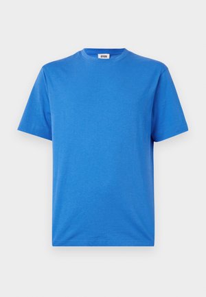 Blue cotton T-shirt with a round neck and short sleeves, featuring a smooth texture and a relaxed fit, with a label at the neckline.