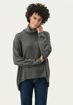 Gray turtleneck sweater in a soft, textured knit. Relaxed fit with side slits, worn over dark blue jeans. Simple, classic design.