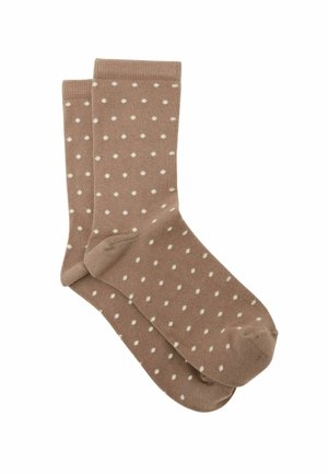 Ruskeat nilkkamittaiset sukat, joissa on pieniä valkoisia pilkkuja, resorit ja neulottu tekstuuri, esitetty taitettuna parina.