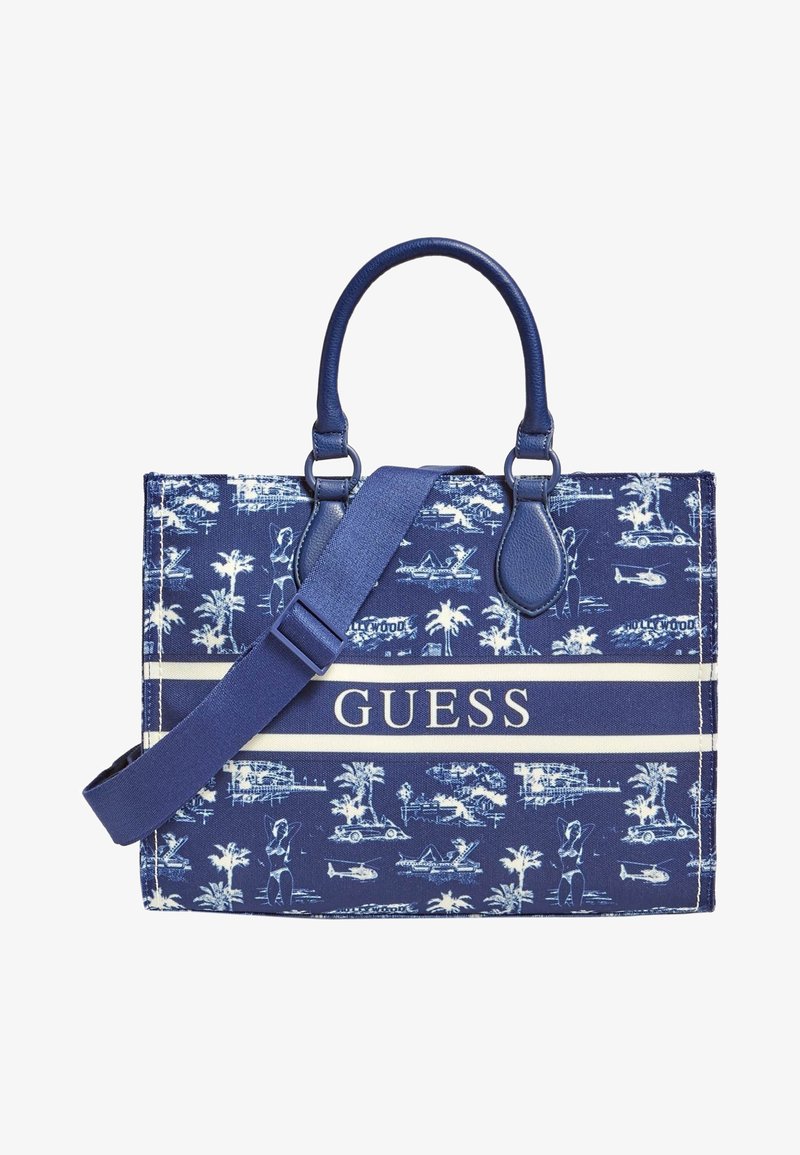Granatowa torebka wykonana z tkaniny z wzorem palm i vintage'owego samochodu. Posiada podwójne rączki u góry, regulowany pasek na ramię oraz detal z logo.