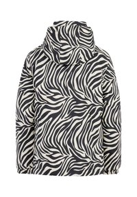 Vuorattu takki, jossa on musta ja kerma zebra-raita -kuvio, varustettuna hupulla, joustavilla hihansuilla ja rentoa istuvuutta.