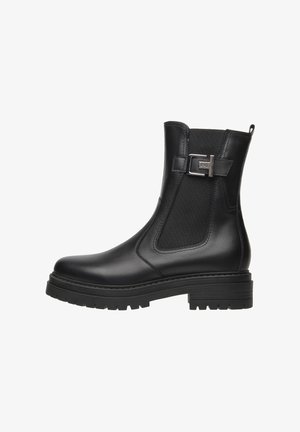 Bottine noire avec une surface en cuir lisse, des panneaux latéraux élastiques et un accent métallique. Semelle robuste avec un léger talon. Tirette latérale incluse.