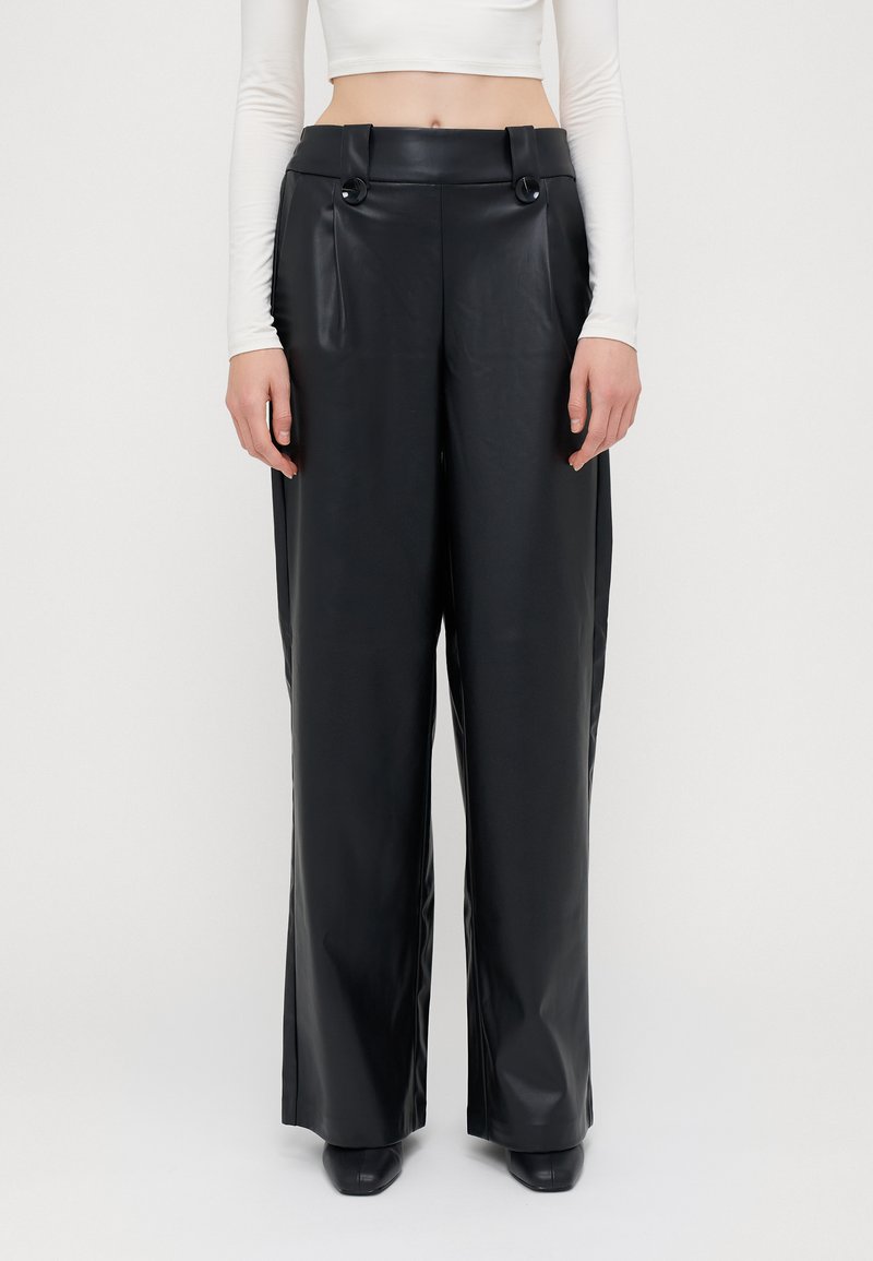 Black faux leather wide-leg pants with a high waist, featuring two front pockets and decorative buttons at the waistband. Smooth texture.