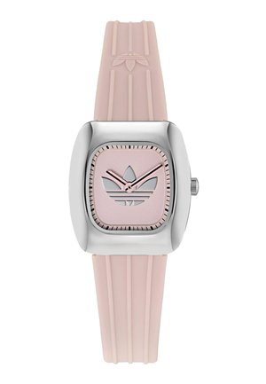 Kwadratowy zegarek z srebrną kopertą ze stali nierdzewnej i różowym gumowym paskiem. Posiada różową tarczę z srebrnym logo w postaci trzech pasków oraz srebrne wskazówki.