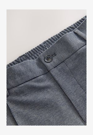 Tume sinine tekstureeritud kangas peene mustriga. Omaduseks on nööpidega kinnis ja elastne vöökohal, mis tagab paindlikkuse ja mugavuse.