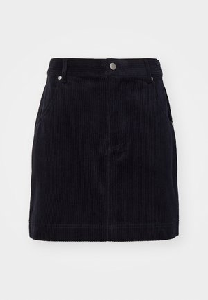 Granatowa spódnica z korduroy o dopasowanym kroju, z pionowymi wypustkami, dwoma bocznymi kieszeniami oraz zapięciem na guziki z przodu.