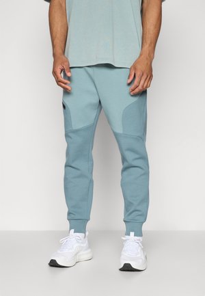 UNSTOPPABLE FLEECE - Träningsbyxor - jasper blue/serpentine/black