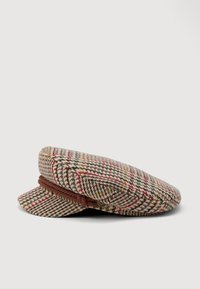 Ull flat cap i en houndstooth-mønster med grønne, røde og beige farger. Har en flettet brun band og en svakt buet skygge.