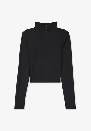 Top nero a maniche lunghe realizzato in tessuto a coste, con colletto alto e chiusura con zip frontale. Design cropped con una silhouette aderente.