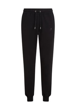 Schwarze Jogginghose aus Stoff mit einem Kordelzug-Bund, engen Bündchen und einem kleinen Logo auf der linken Vorderseite. Weiche Textur und lässige Passform.