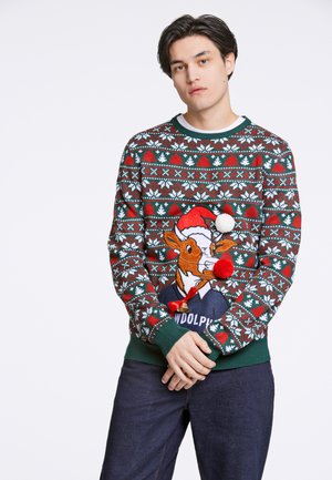 Stickad jultröja med ett geometriskt mönster i rött, grön och vitt, med en broderad ren i tomteluva och pom-pom detaljer.
