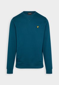 Sweatshirt à manches longues couleur bleu sarcelle avec des poignets et un ourlet côtelés, petit logo brodé jaune sur la poitrine gauche et détails de col cousus.