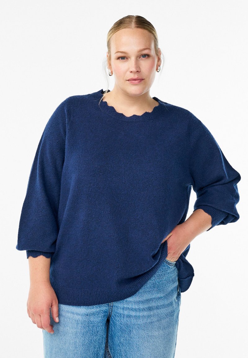 Navy blue knit sweater with a scalloped neckline and three-quarter sleeves, crafted from soft material; relaxed fit with side slits.