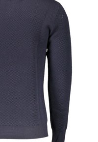 Maglione blu navy con trama a nido d'ape, polsini e orlo a coste, silhouette aderente e maniche lunghe.