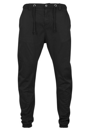 Black jogger pants made of soft fabric, featuring an elastic waistband with drawstrings, side pockets, and tapered cuffs at the ankles.
