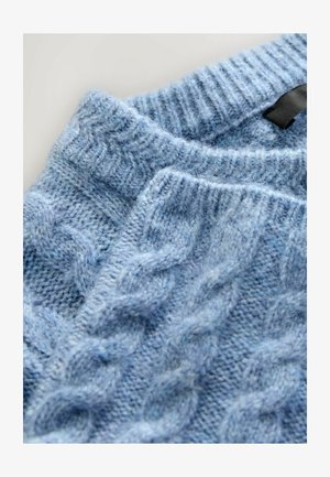 Light blue knitted sweater featuring a cable pattern, with a ribbed neckline and soft texture. The fabric appears fuzzy and warm.