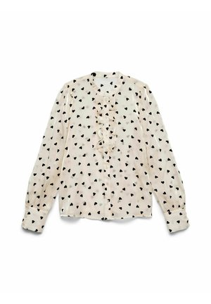 Lichtbeige blouse met lange mouwen en een rimpelvoorkant, voorzien van een zwart hartpatroon, knoopsluiting en gather-mouwen.