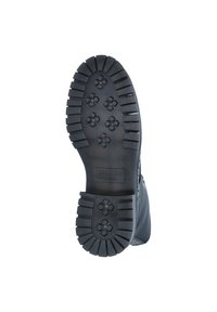 Schwarze Gummistiefelsohle mit einem strukturierten Design, tiefen Profilierungen und blumenförmigen Mustern für besseren Grip. Logo auf der Zwischensohle vorhanden.