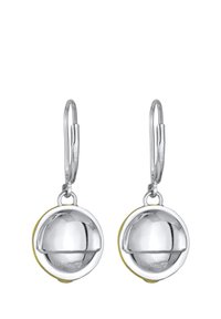 Boucles d'oreilles pendantes en ton argent, ornées de charms ronds à la surface réfléchissante et aux accents jaunes à la base. Crochets en acier inoxydable.