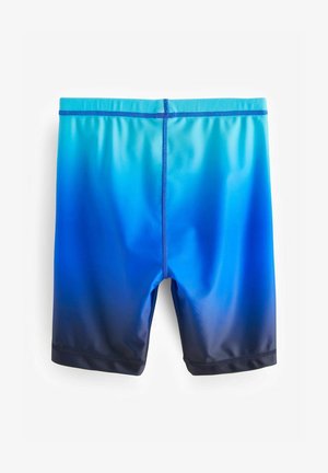 Kék úszónadrág, amelynek színátmenete világos kékből sötét kékbe megy. Simogató, elasztikus anyagból készült, egyszerű varrással.