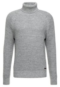 Grey knitted turtleneck sweater with a textured pattern, ribbed cuffs, and hem. Features raglan sleeves and a minimal logo detail at the bottom.