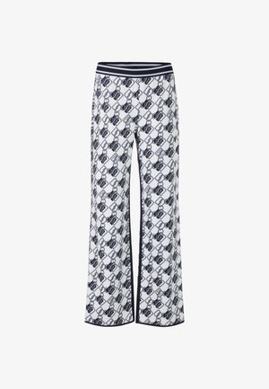 Wide-leg pants in white with a navy chain-link pattern. Features a navy striped waistband and a smooth, soft texture.