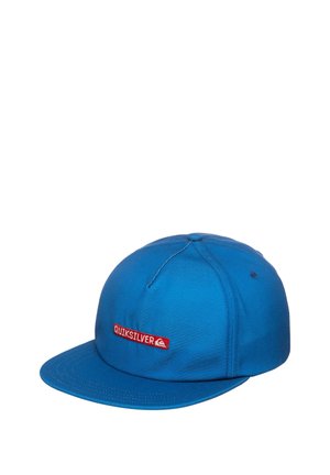 Blue cap made of fabric with a flat visor, featuring a red rectangular logo patch that says "Quiksilver." Simple design, no patterns or embellishments.