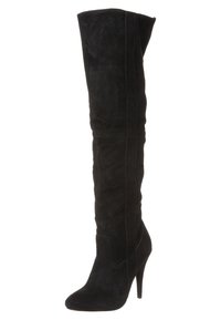 Bottes mi-cuisses en daim noir avec bout pointu, talon aiguilles et coutures verticales sans couture pour une silhouette élégante.