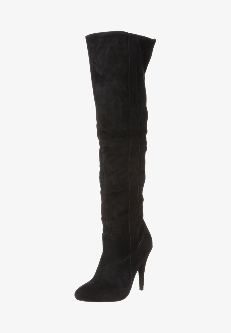Bottes mi-cuisses en daim noir avec bout pointu, talon aiguilles et coutures verticales sans couture pour une silhouette élégante.