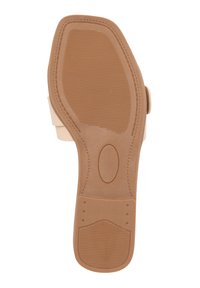 Suola di scarpa color beige chiaro con una superficie testurizzata per aderenza. Presenta una forma arrotondata e un bordo liscio, progettata per comfort e durata.