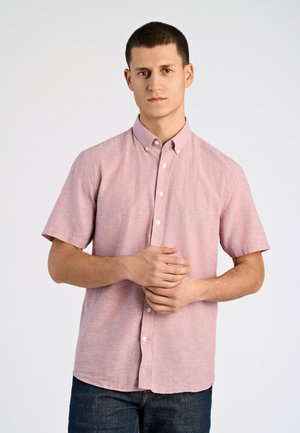 Camicia a maniche corte con bottoni di colore rosa chiaro, realizzata in tessuto testurizzato, con colletto standard e vestibilità leggermente rilassata.