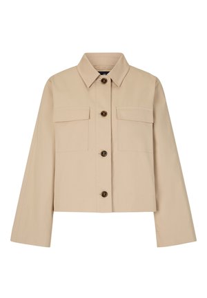 Giacca cropped beige chiaro con colletto, due taschini sul petto e bottoni marroni. Realizzata in un tessuto morbido e resistente.
